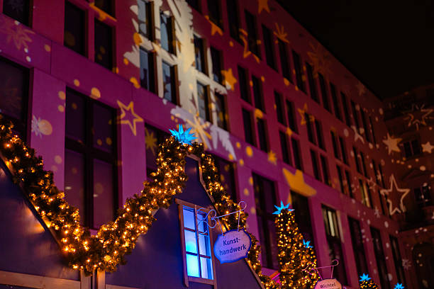 istock Decorative Star Projections Above Christmas Fair Stalls 2251717757