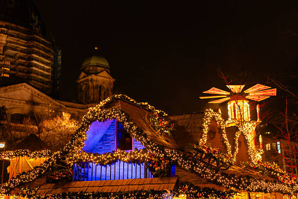 Lutheran church of Our Lady aka Frauenkirche with decorated and illuminated Christmas street at night in Dresden, Saxony, Germany