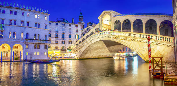 The Grand Canal and the Rialto Bridge at sunset in Venice, Italy