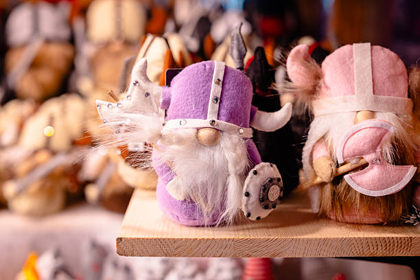 Viking style gnome figurines displayed at a festive Christmas market stall.