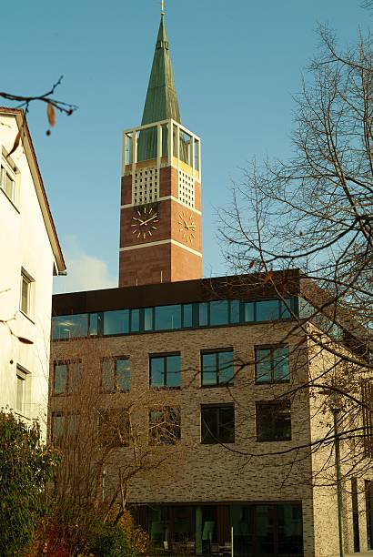 istock Brick Wall, Stone Path, Tall Trees and Church Tower, German Town 2251722487
