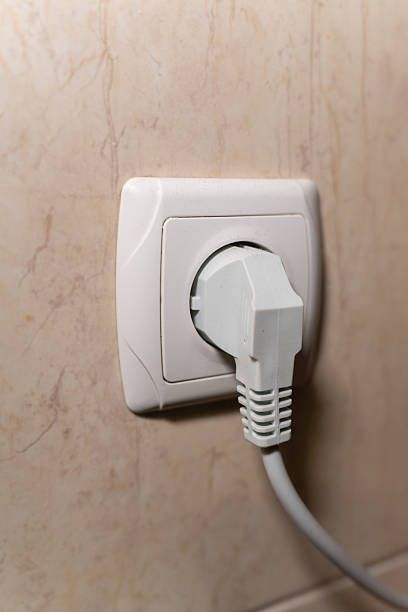 istock A close-up shot of a white electrical plug inserted into a wall socket, highlighting home electricity, safety, and everyday household power usage. Clean and simple composition suitable for illustrating energy or technology concepts. 2251725434