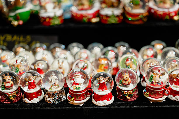 Christmas market souvenirs featuring decorative snow globes.