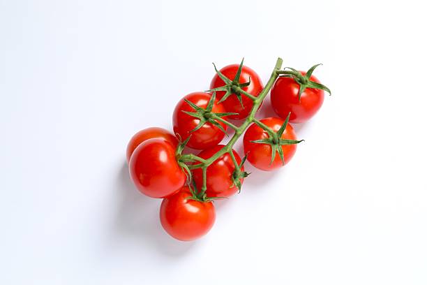 istock Flat lay composition with fresh cherry tomatoes on white background. Ripe vegetables 2251728142
