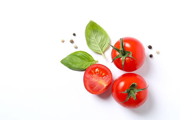 istock Fresh red tomatoes, pepper and basil on white background, top view 2251728157