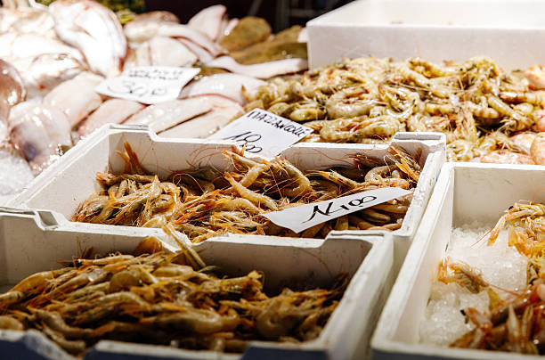 istock Fresh seafood market display with shrimp and fish on ice 2251729106