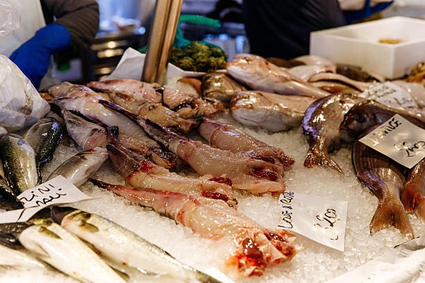 istock Fresh fish market display with various seafood on ice 2251729168