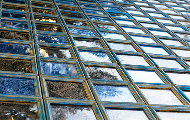 Reflective glass tile wall with wooden frames