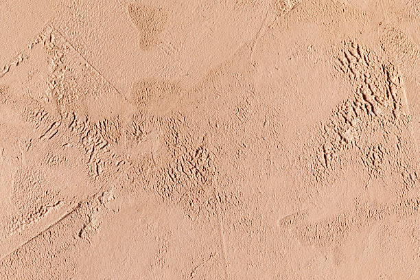 istock Elegant pink and beige plaster texture, decorative plastered surface, seamless vintage background for wall design, branding, packaging and architectural images 2251731919