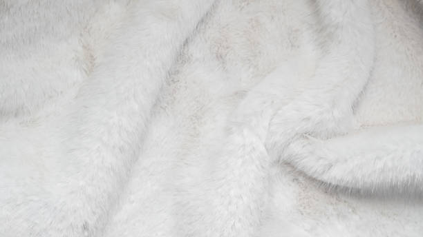 istock Soft white fur background texture symbolizing winter luxury and warmth. 2251732535
