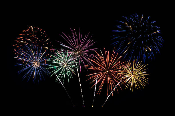 istock Festive colorful fireworks display isolated on black background 2251734143