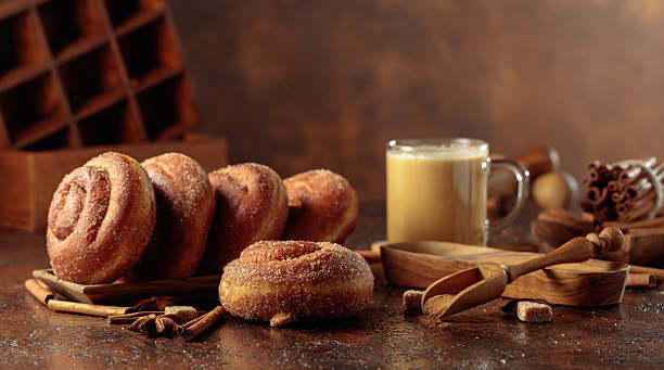 istock Swedish cinnamon rolls and coffee latte on a brown background. 2251737843