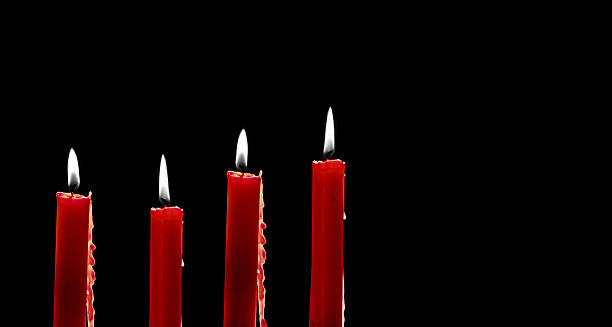 istock Burning Christmas candles with glowing flame 2251741729