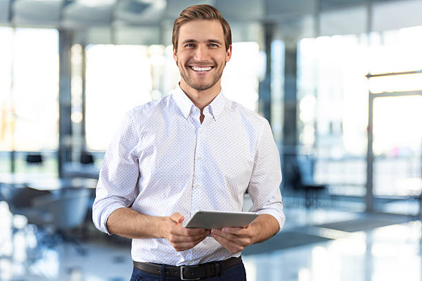 istock Handsome businessman using his tablet in the office. 2251742461