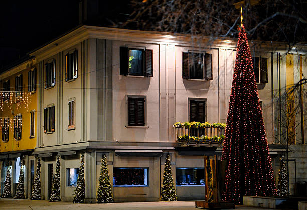 istock Christmas Tree and Holiday Decorations in Town Square at Night 2251742812
