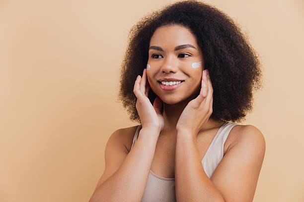 istock African American woman applying cream for beauty routine 2251743023
