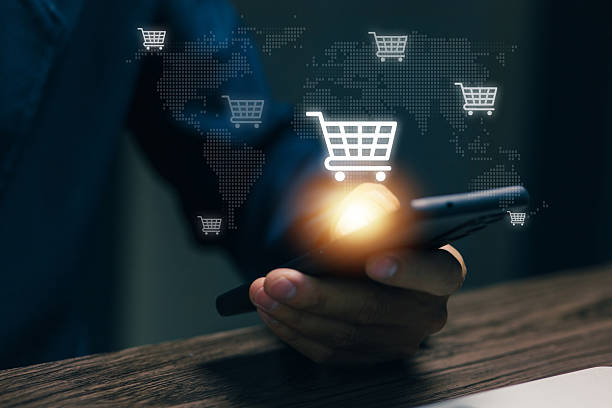 istock A smartphone displays a digital shopping cart across a global map, representing e-commerce, online shopping, international trade, digital retail platforms, and worldwide business connectivity. 2251744949