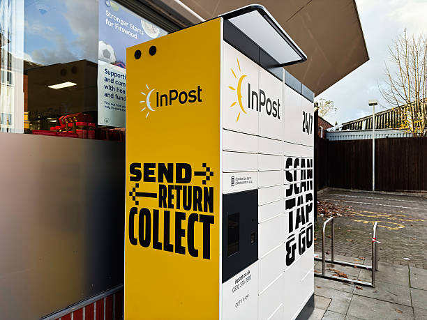 Manchester, UK - November 13, 2025: Bright yellow InPost parcel locker in Manchester offering send, return and collect services.