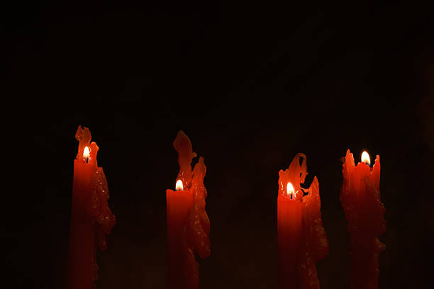 istock Dramatic Red burning candles warm, atmospheric scene 2251745609