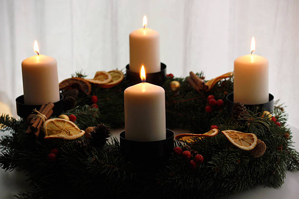 istock Handmade advent wreath with four burning white candles 2251750977