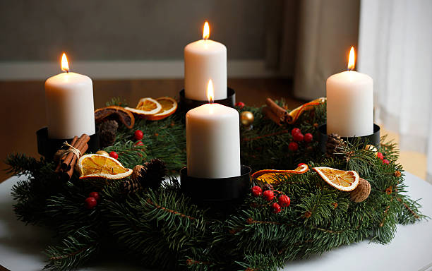 istock Handmade advent wreath with four burning white candles 2251750978