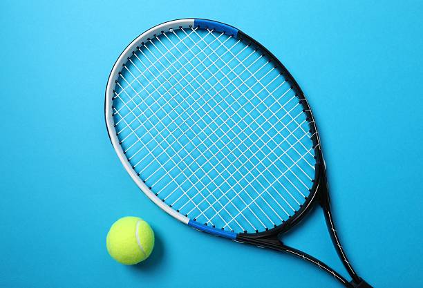 istock Tennis racket and ball on color background 2251762585
