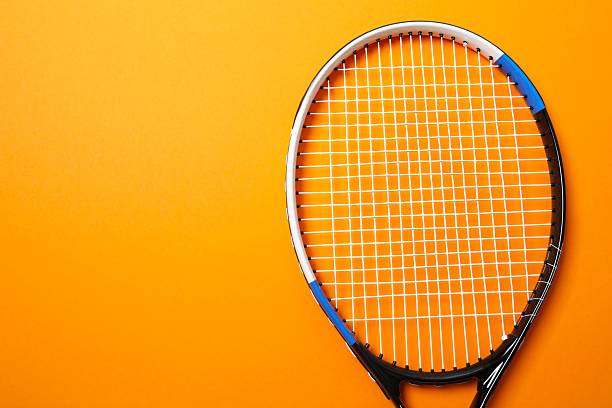 istock Tennis racket and balls on color background 2251762623