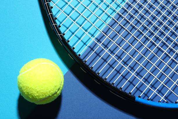 istock Tennis racket and ball on color background 2251762640