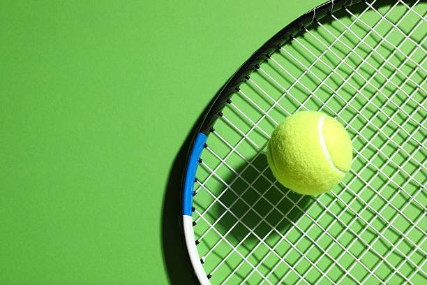 istock Tennis racket and ball on color background 2251762703
