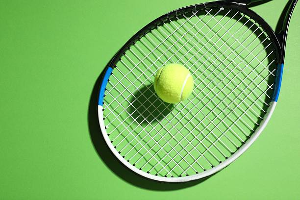 istock Tennis racket and ball on color background 2251762713