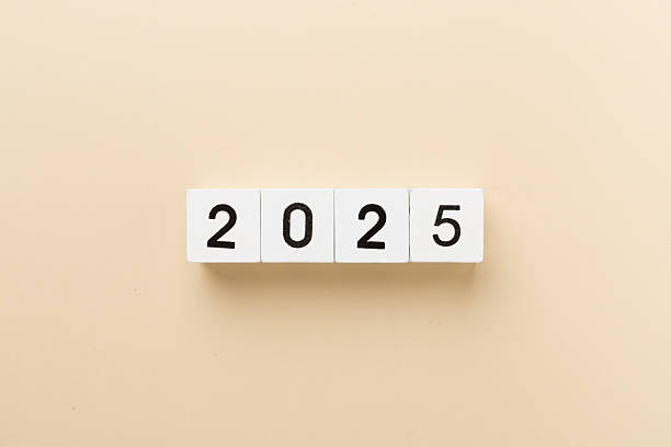 istock Cubes with 2025 on color background, top view 2251764692