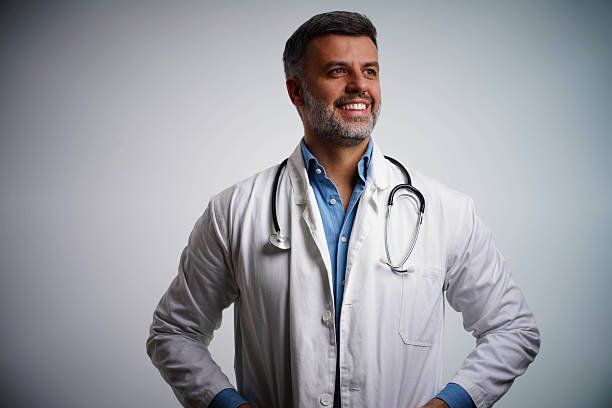 istock Smiling handsome male doctor posing at camera. 2251765523