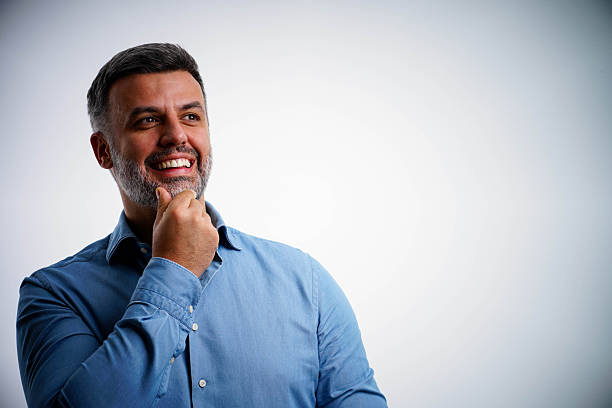 istock Happy casual guy smiling and dreaming. 2251765526