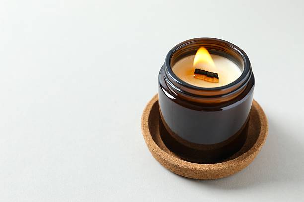 istock Aromatic soy candle on color background 2251766507