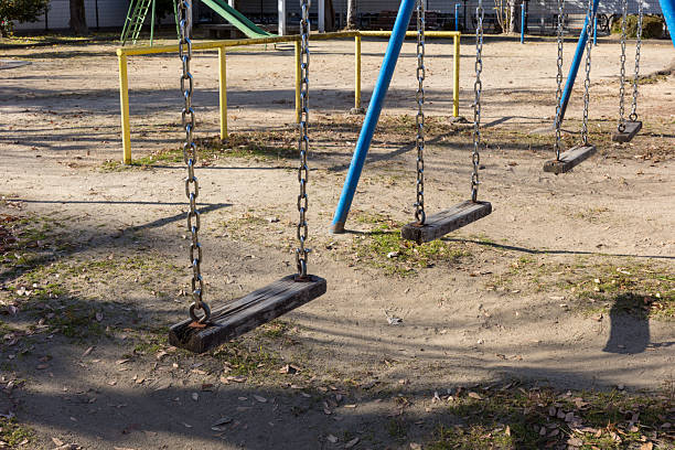 Nostalgic playground scene with a vintage wooden swing