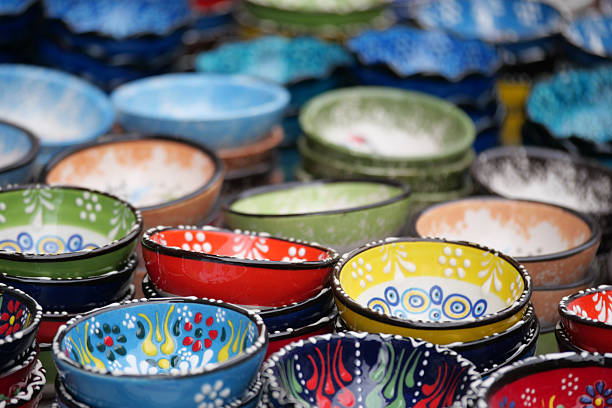 Colorful ceramic soup bowls on display. Kitchen decor, pastel dishware, and vibrant tableware with vintage flair