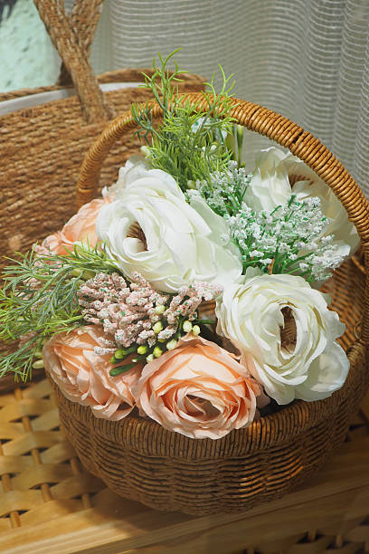 istock Beautiful floral arrangement in a wicker basket for decor 2251768401
