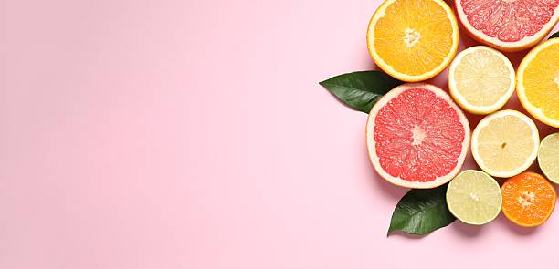 istock Summer tropical composition. Green leaf and tropical fruits on a colored background. Summer concept. Flat lay, top view, copy space 2251769357