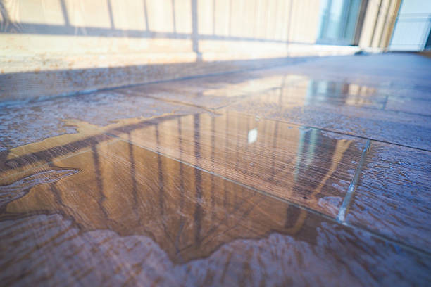 istock Reflection of sunlight on a wet floor in a modern building 2251769519