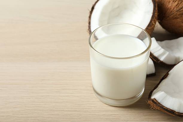 istock Glass of milk with coconuts on the table 2251769615
