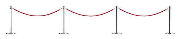 Red ropes connect stanchions often used in controlling the flow of pedestrians where people queue at businesses or special events.