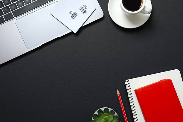 istock Workplace with laptop, coffee cup, pencil and notebook, top view 2251772812
