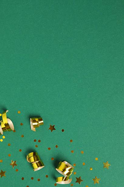 istock Golden confetti on green background, top view 2251773134