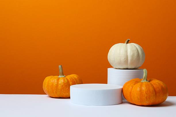 istock White podiums with pumpkins on two tone background 2251773187