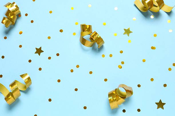 istock Golden confetti on color background, top view 2251773269