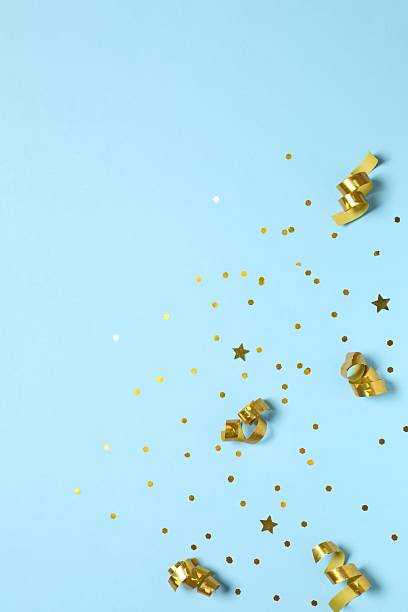 istock Golden confetti on color background, top view 2251773270
