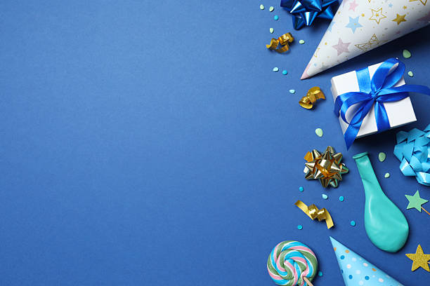 istock Frame of different party items and decorations with space for text on blue background, flat lay 2251773284