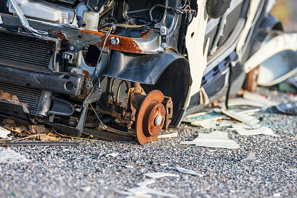 istock Severely damaged car wreck with exposed rusted structure. 2251774997