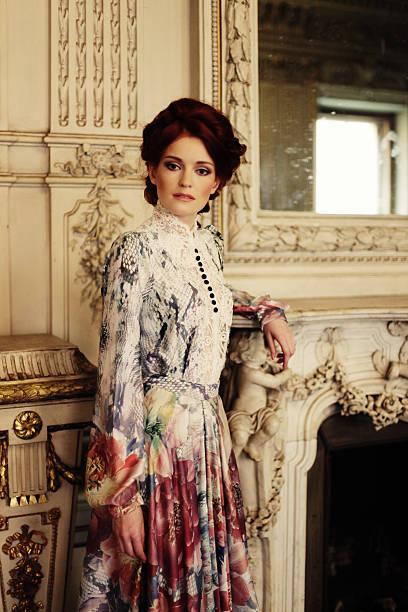 istock woman  posing next to the fireplace 2251776237