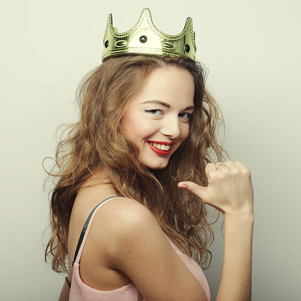 istock young blond woman in crown 2251776241